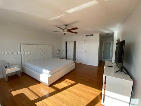 a bathroom with a double vanity sink toilet mirror and shower