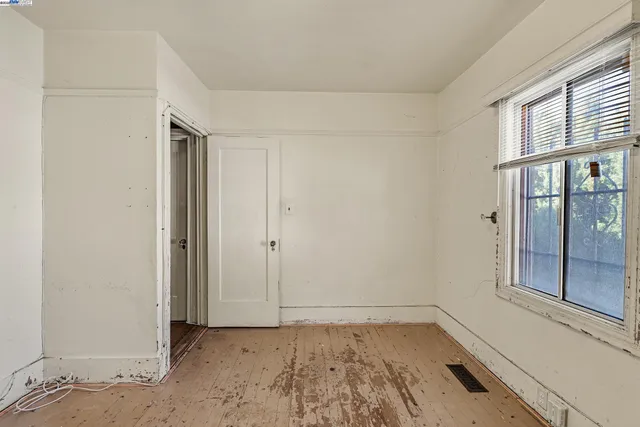 a view of hallway with wooden floor