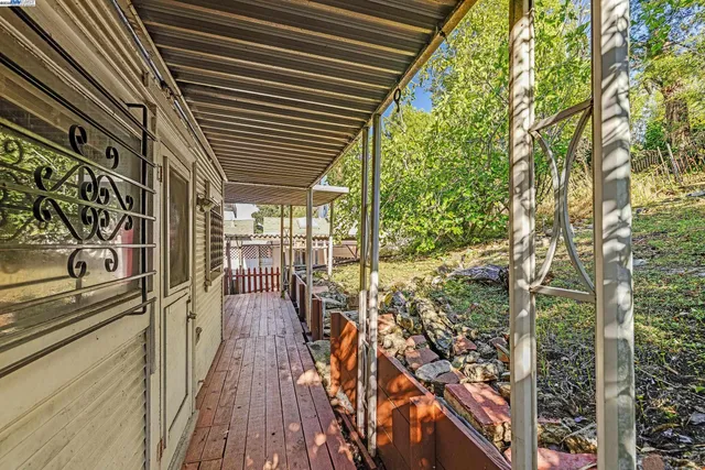 a view of a balcony with wooden floor