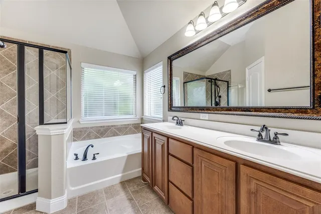 a bathroom with a bathtub and a sink