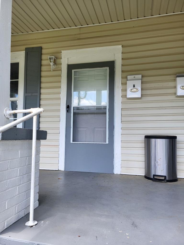 2827 Waverly Avenue, Unit A Columbus, GA 31904 - Photo 3 of 4 a front view of a house with a garage