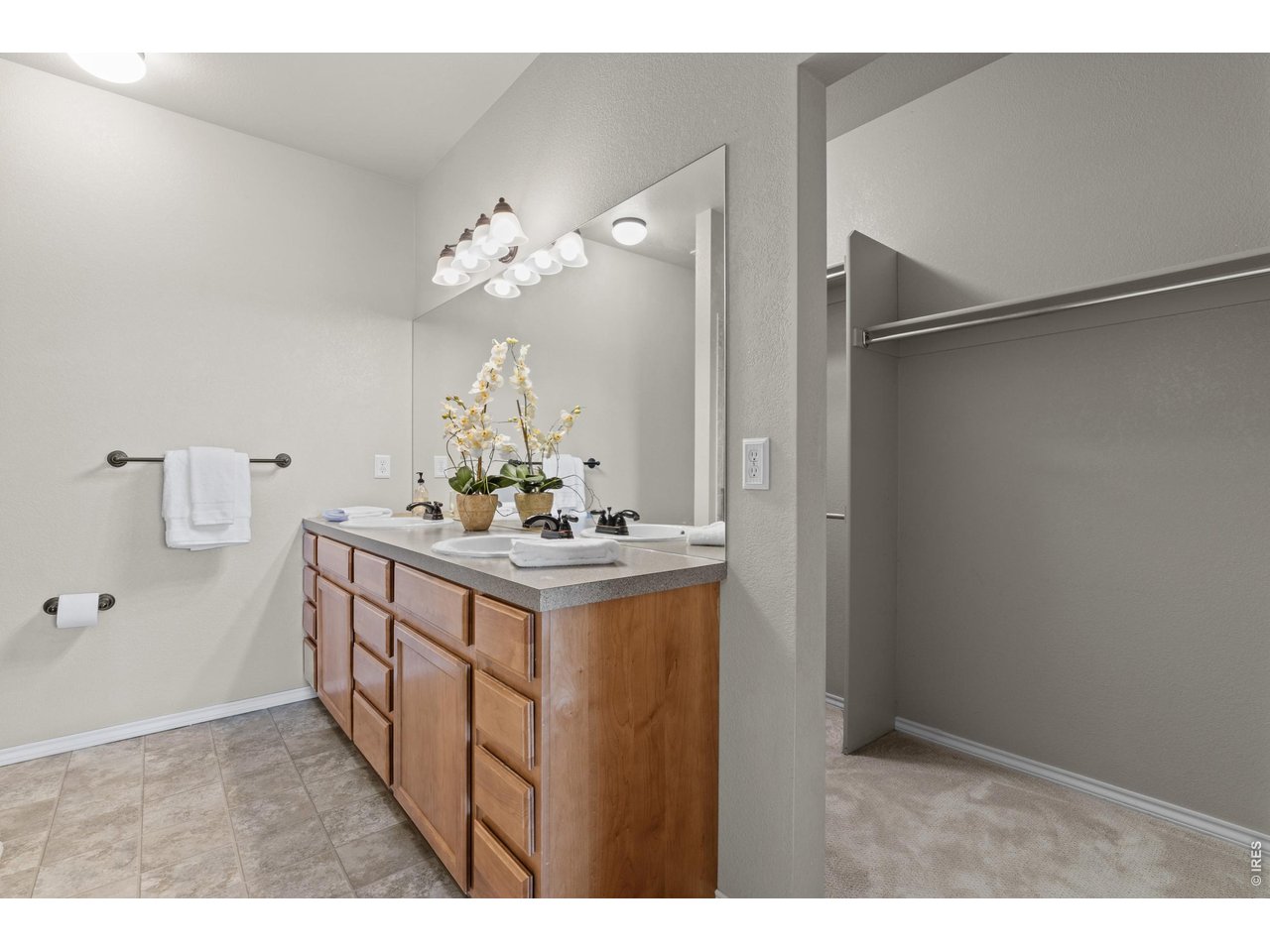 6911 West 3rd Street, Unit 810 Greeley, CO 80634 - Photo 14 of 28 a bathroom with a sink vanity and a mirror