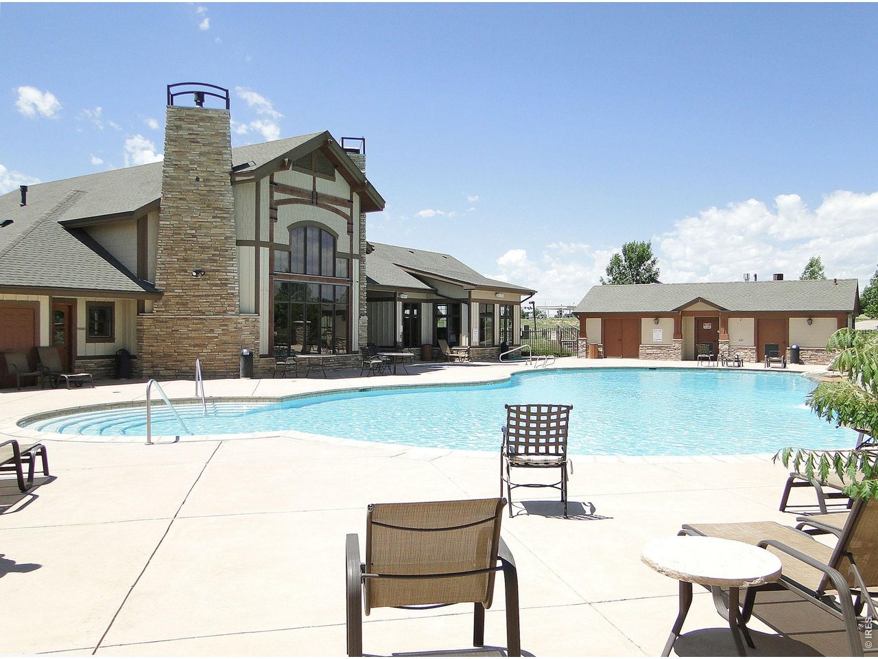 6911 West 3rd Street, Unit 810 Greeley, CO 80634 - Photo 28 of 28 a front view of a house with a yard