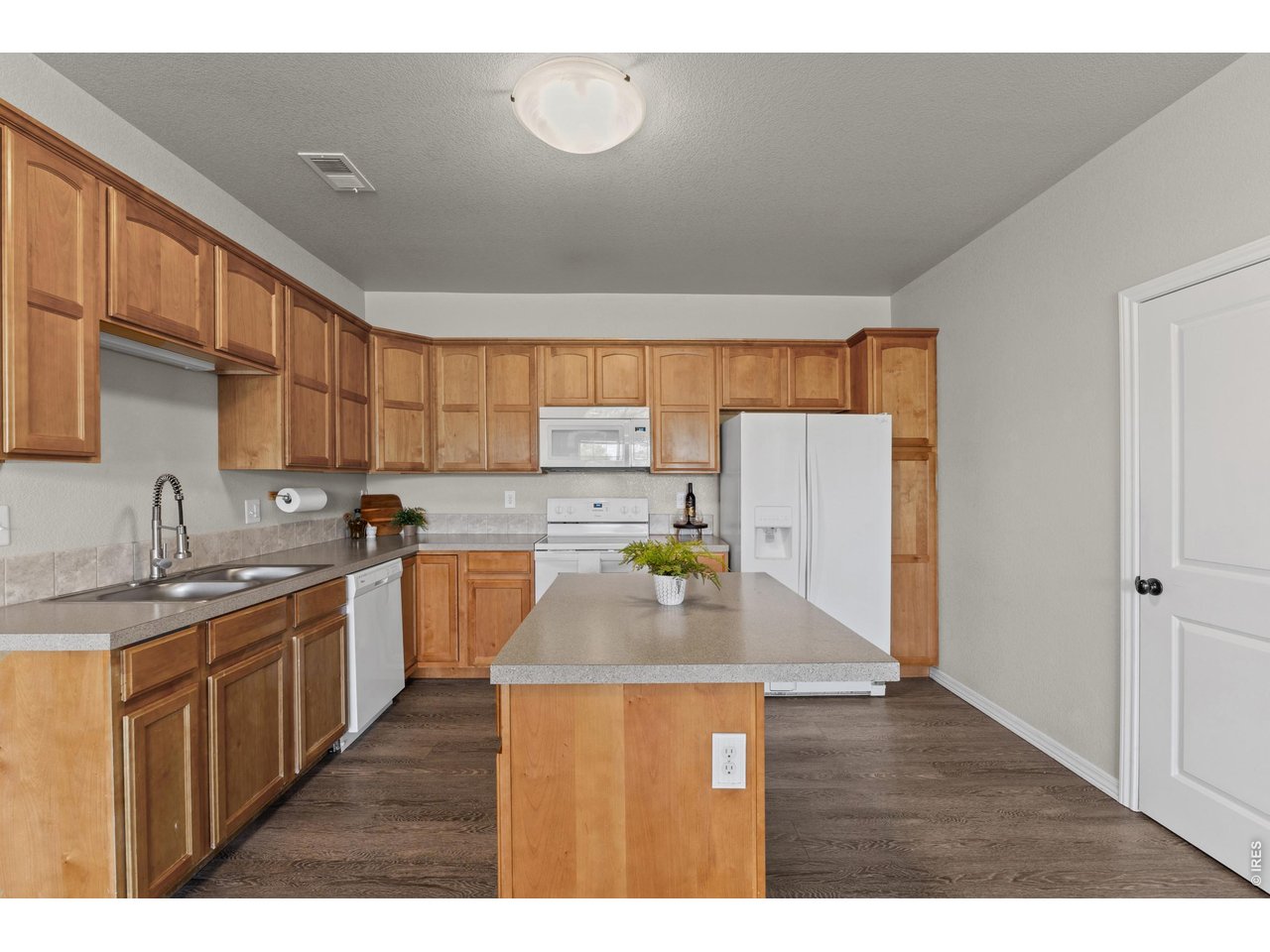 6911 West 3rd Street, Unit 810 Greeley, CO 80634 - Photo 8 of 28 a kitchen with stainless steel appliances granite countertop a sink window and cabinets