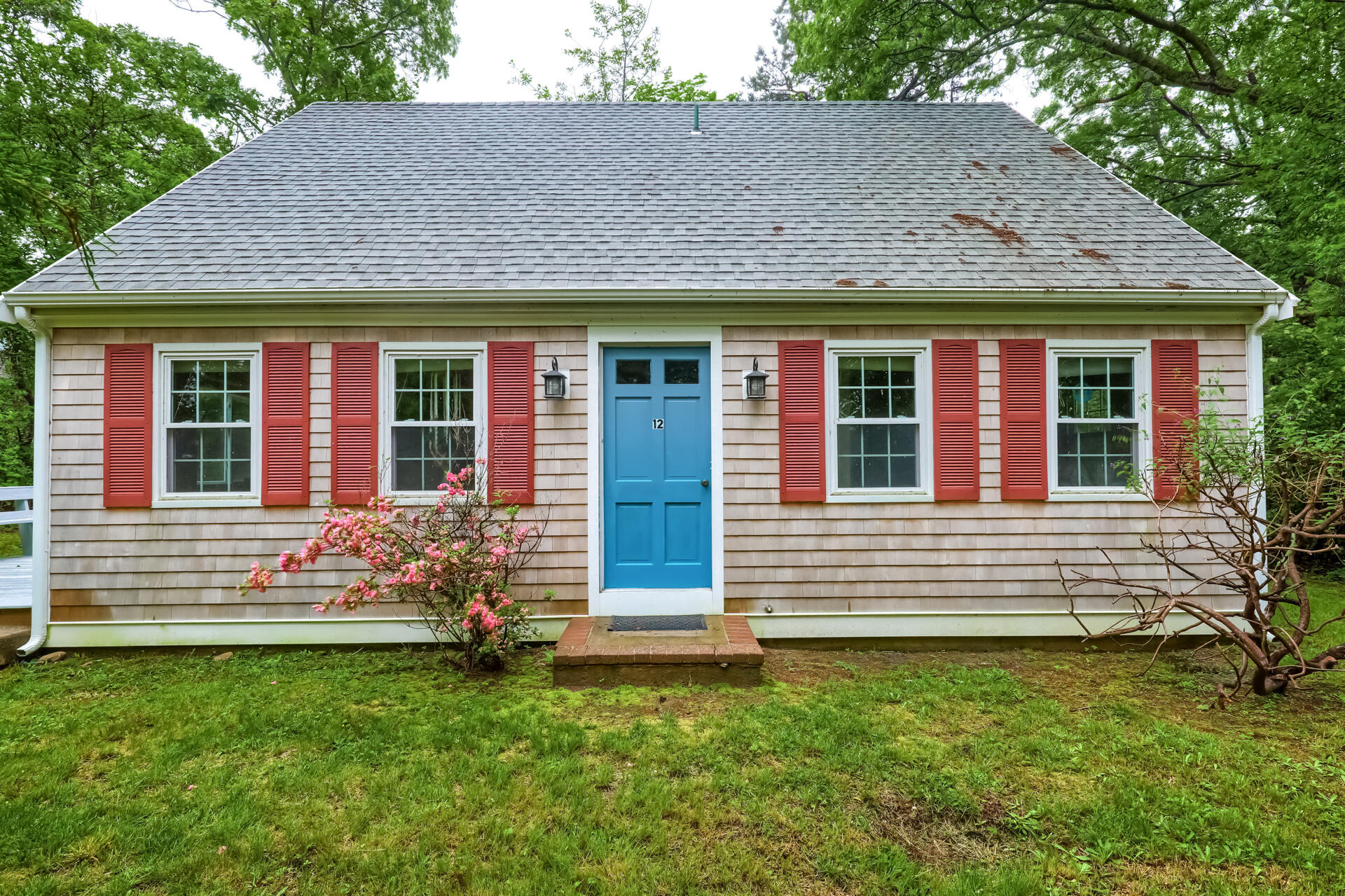 12 Captain Teach Road East Sandwich, MA 02537 - Photo 2 of 24 front view of a house with a yard