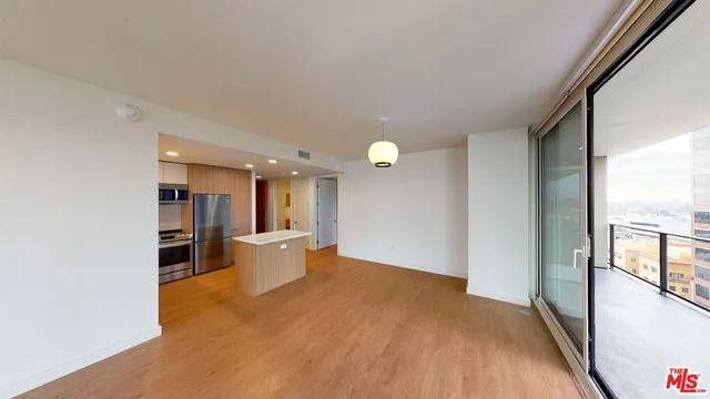 a view of a kitchen with workspace and a window