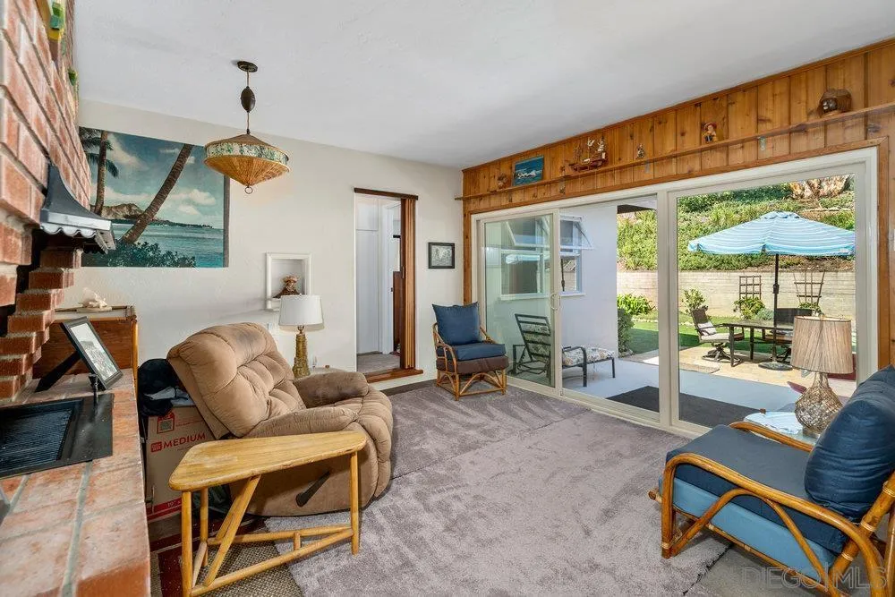 6109 Waverly Avenue La Jolla, CA 92037 - Photo 13 of 23 a living room with furniture a floor to ceiling window and floor to ceiling windows