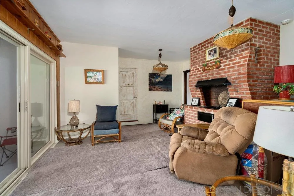 6109 Waverly Avenue La Jolla, CA 92037 - Photo 14 of 23 a living room with furniture and a fireplace