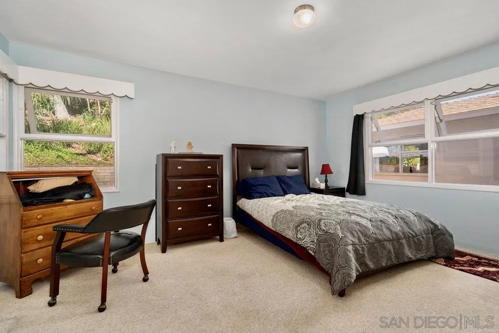 6109 Waverly Avenue La Jolla, CA 92037 - Photo 20 of 23 a bedroom with a bed and a window
