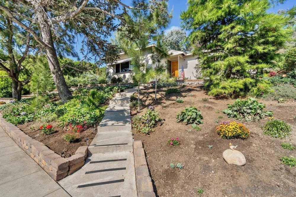 6109 Waverly Avenue La Jolla, CA 92037 - Photo 6 of 23 a view of a pathway with a flower plants