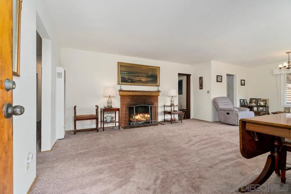 6109 Waverly Avenue La Jolla, CA 92037 - Photo 7 of 23 a living room with furniture and a fireplace