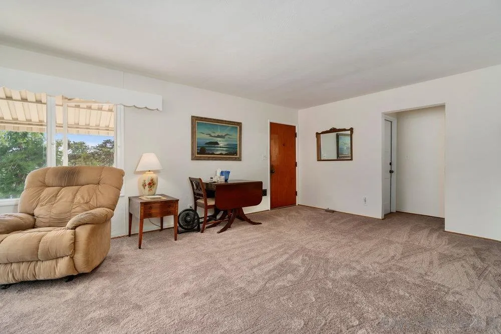 6109 Waverly Avenue La Jolla, CA 92037 - Photo 8 of 23 a living room with furniture and a window