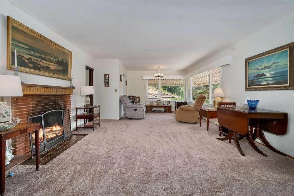 6109 Waverly Avenue La Jolla, CA 92037 - Photo 9 of 23 a living room with furniture and a fireplace