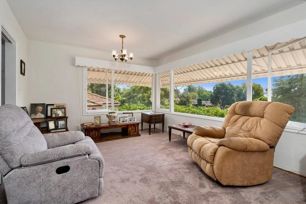 6109 Waverly Avenue La Jolla, CA 92037 - Photo 10 of 23 a living room with furniture and a large window