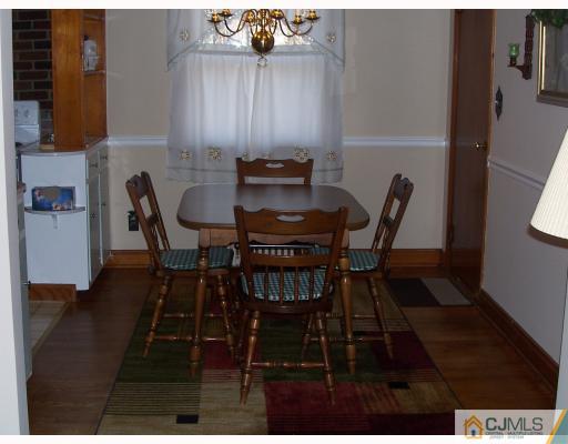 50 East Cliff Road Colonia, NJ 07067 - Photo 3 of 10 a view of a dining room with furniture and wooden floor