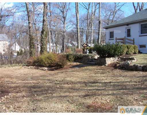 50 East Cliff Road Colonia, NJ 07067 - Photo 8 of 10 a view of a house with a yard