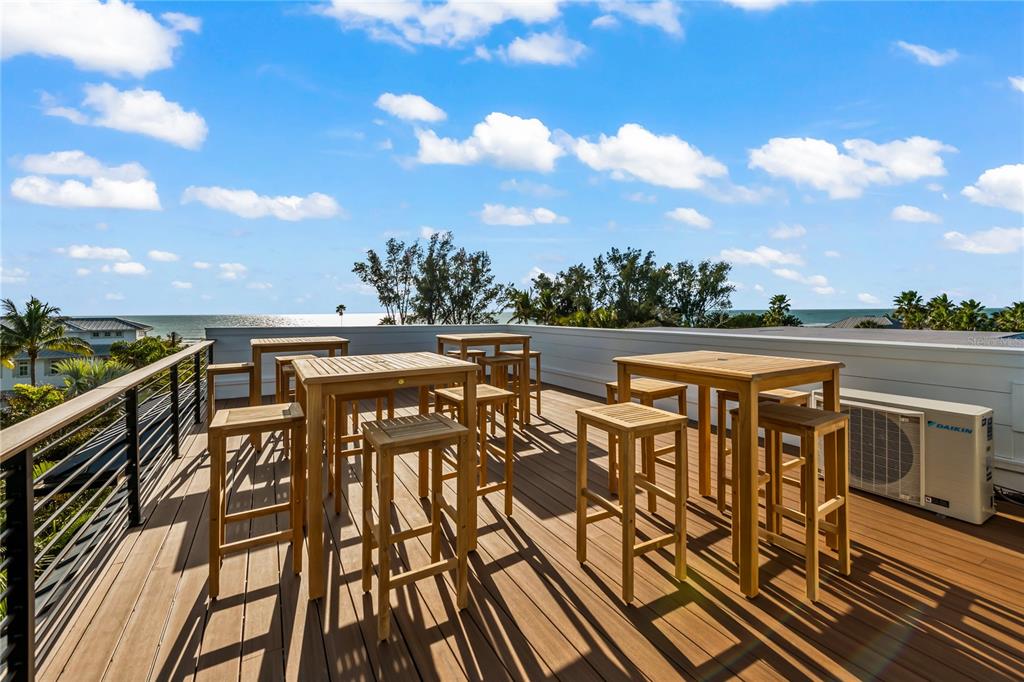 107 Maple Avenue Anna Maria, FL 34216 - Photo 19 of 68 a view of a balcony with furniture