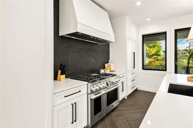a bathroom with a double vanity sink mirror and shower