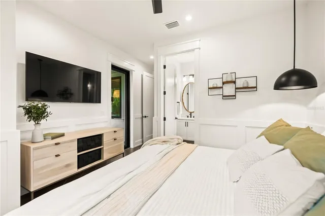 a front view of a house with a yard and a garage