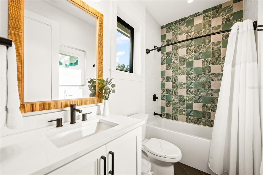 107 Maple Avenue Anna Maria, FL 34216 - Photo 50 of 68 a bathroom with a sink a toilet and shower