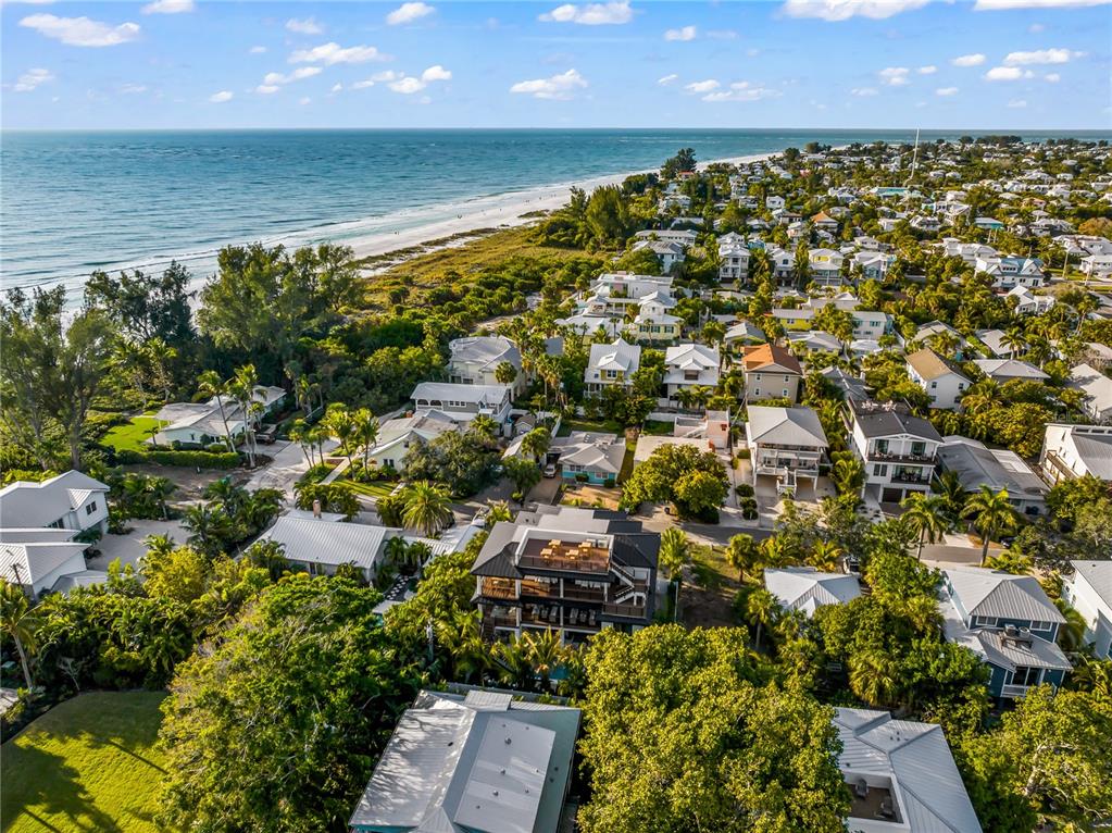 107 Maple Avenue Anna Maria, FL 34216 - Photo 68 of 68 an aerial view of residential houses with outdoor space