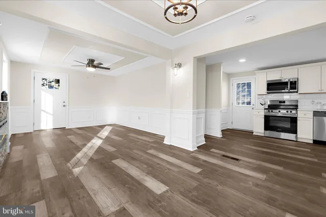 a kitchen with a refrigerator stove and microwave