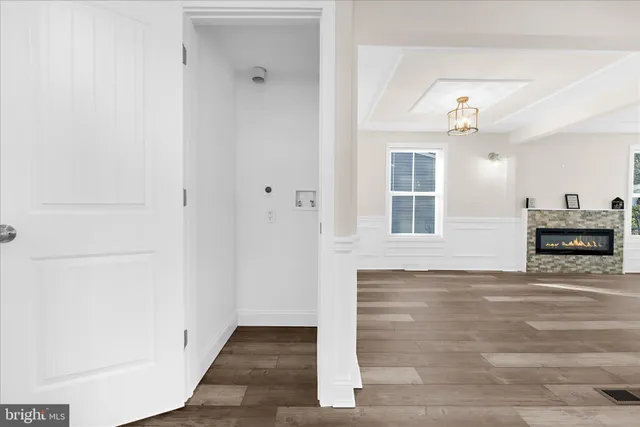 a bathroom with a granite countertop toilet a sink a mirror and bathtub