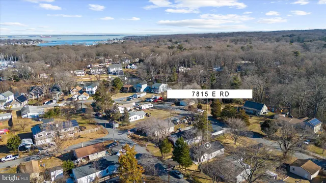 a aerial view of a house with a yard and furniture
