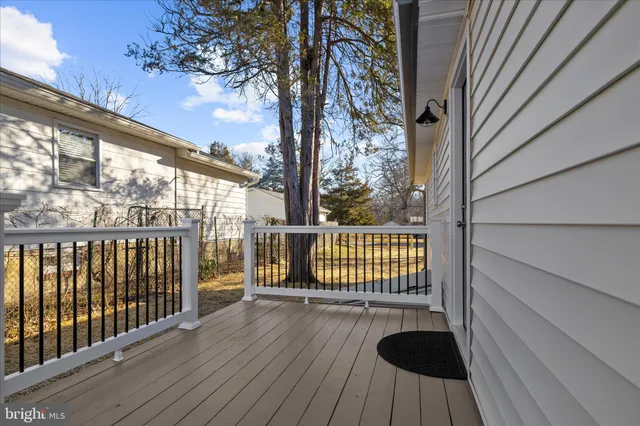 a view of balcony with wooden floor