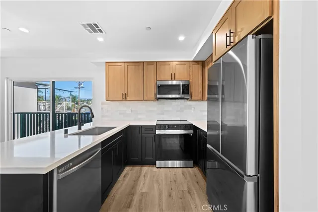 a close view of a utility room with dryer and washer