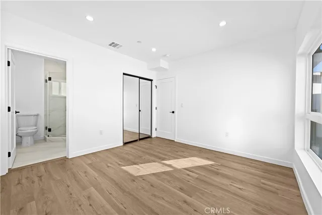 a view of kitchen and wooden floor