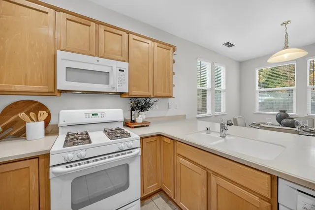 a living room with furniture and next to a window