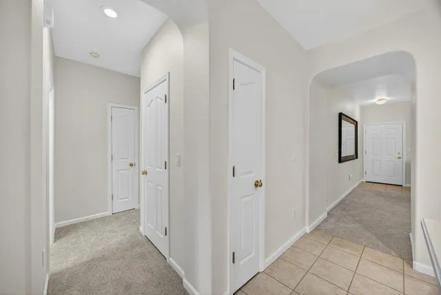 a view of a hallway with kitchen dining table and chair