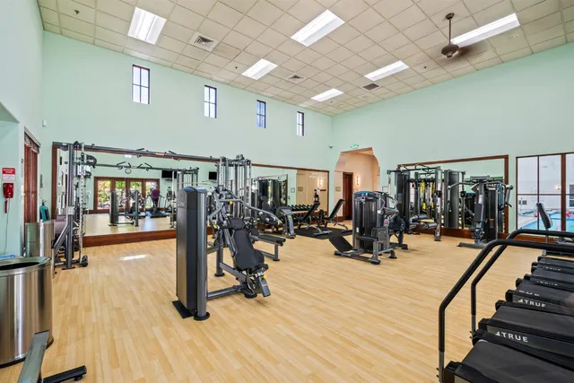 a living room with furniture a rug and a fireplace