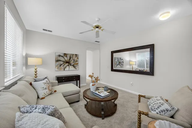 a kitchen with a stove sink and cabinets