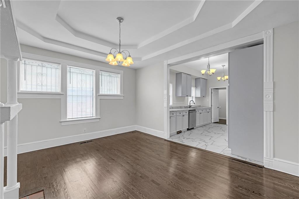 660 Queen Street Southwest, Unit B Atlanta, GA 30310 - Photo 12 of 51 an empty room with wooden floor and windows