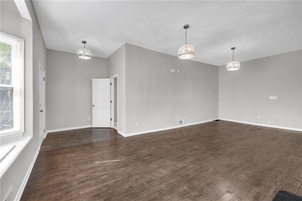 660 Queen Street Southwest, Unit B Atlanta, GA 30310 - Photo 24 of 51 an empty room with wooden floor and windows