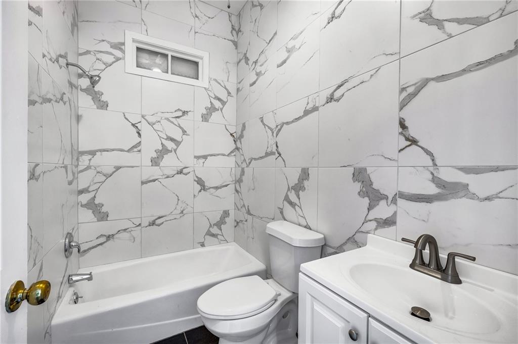 660 Queen Street Southwest, Unit B Atlanta, GA 30310 - Photo 26 of 51 a bathroom with a sink toilet and shower