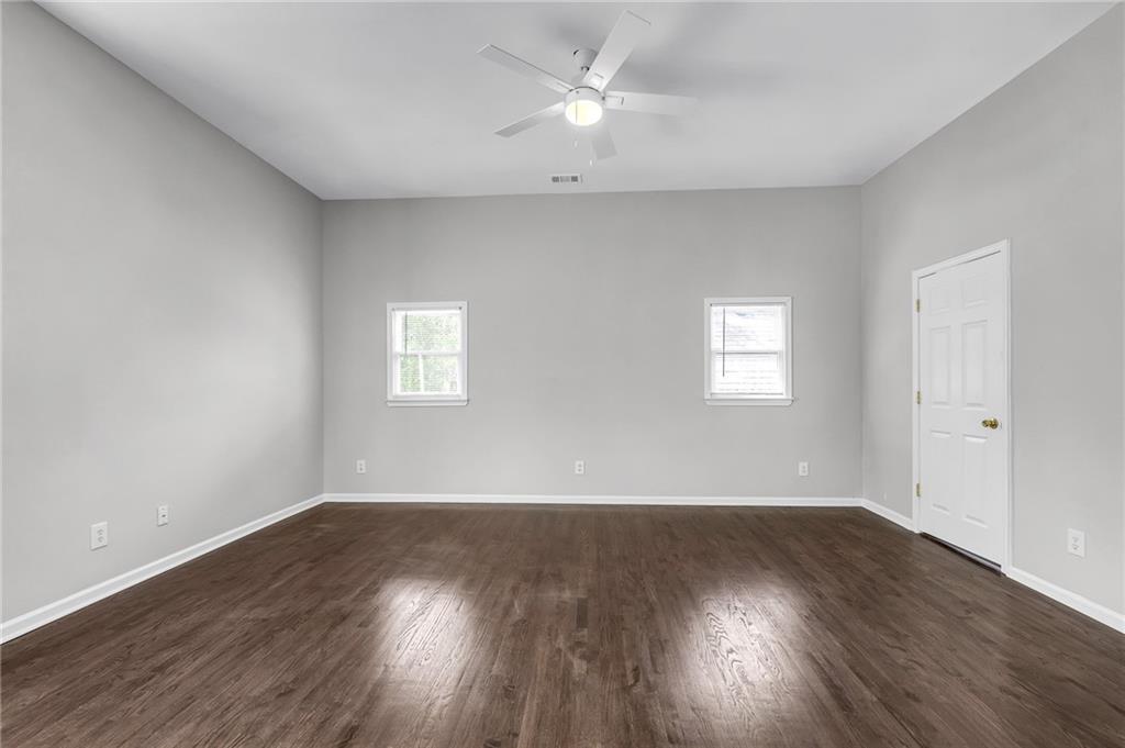 660 Queen Street Southwest, Unit B Atlanta, GA 30310 - Photo 43 of 51 a view of an empty room with wooden floor and a window