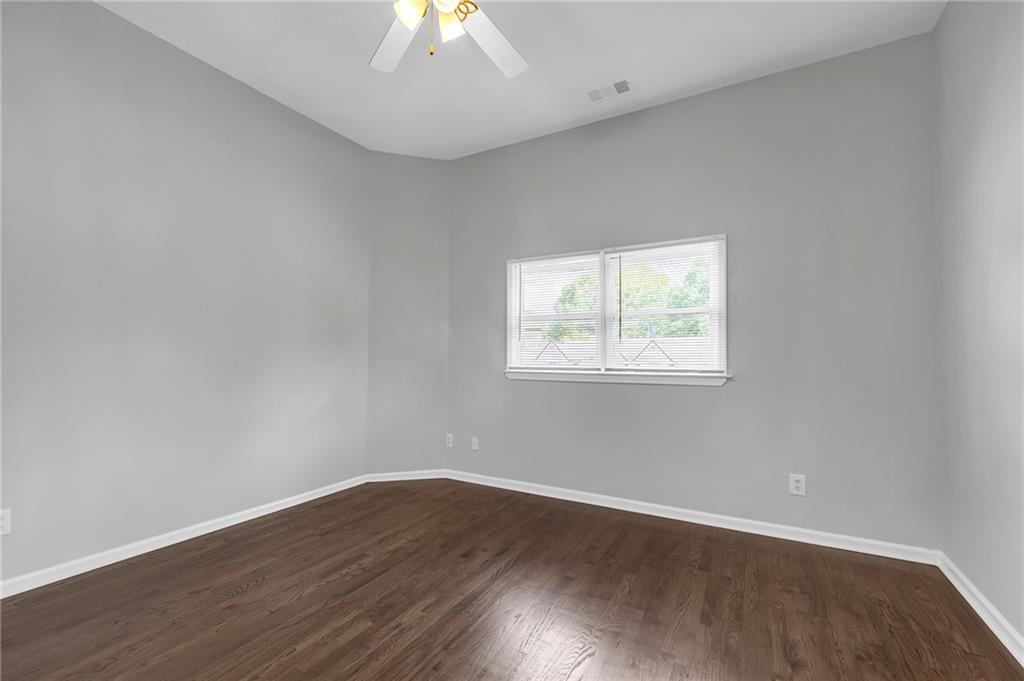 660 Queen Street Southwest, Unit B Atlanta, GA 30310 - Photo 44 of 51 an empty room with wooden floor and windows