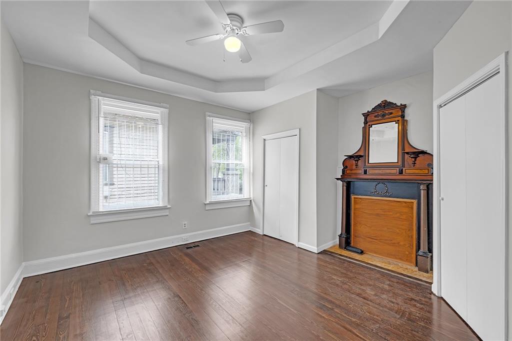 660 Queen Street Southwest, Unit B Atlanta, GA 30310 - Photo 9 of 51 a view of an empty room with a window and wooden floor