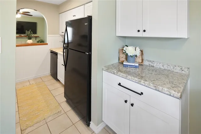 a kitchen with stainless steel appliances granite countertop a refrigerator sink and cabinets