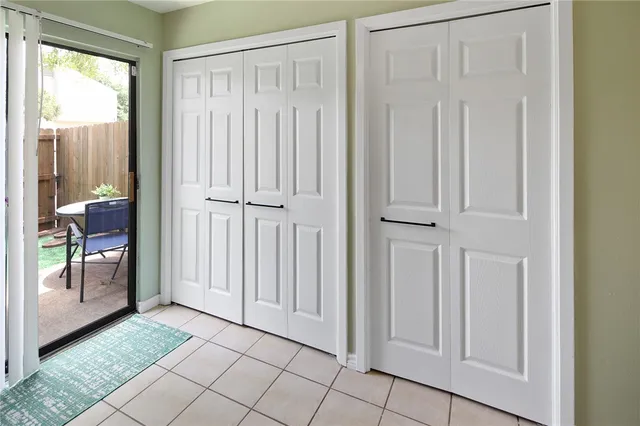 a view of a hallway with an entryway
