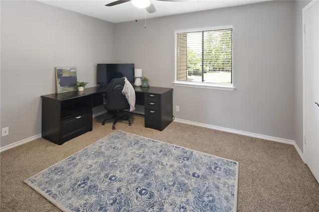 a bed room with a bed and a window