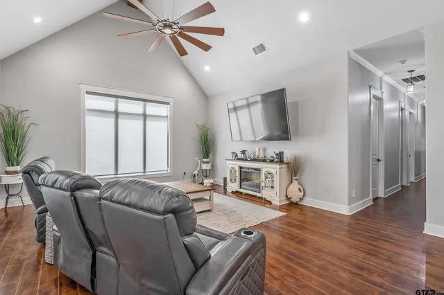 a living room with furniture and a fireplace