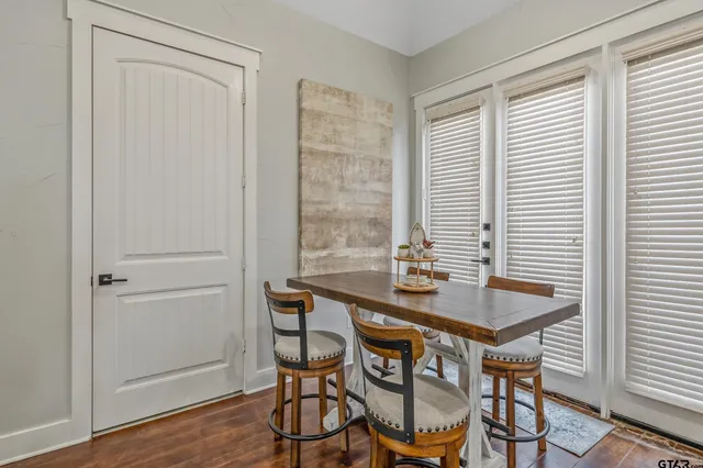 a dining room with furniture and window