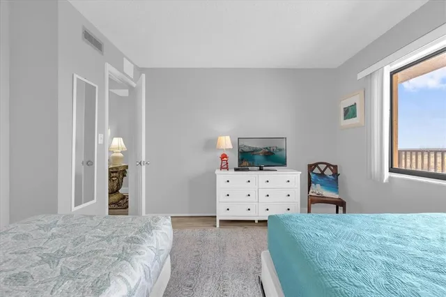 a bedroom with two beds and painted walls