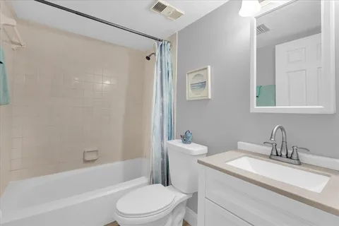 a view of a balcony with chair and wooden floor