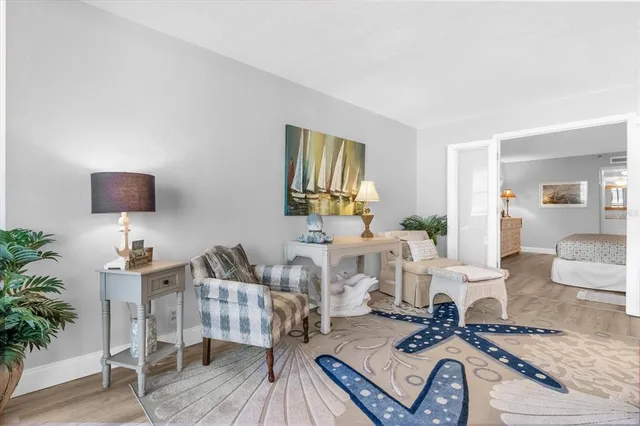 a living room with furniture and a rug