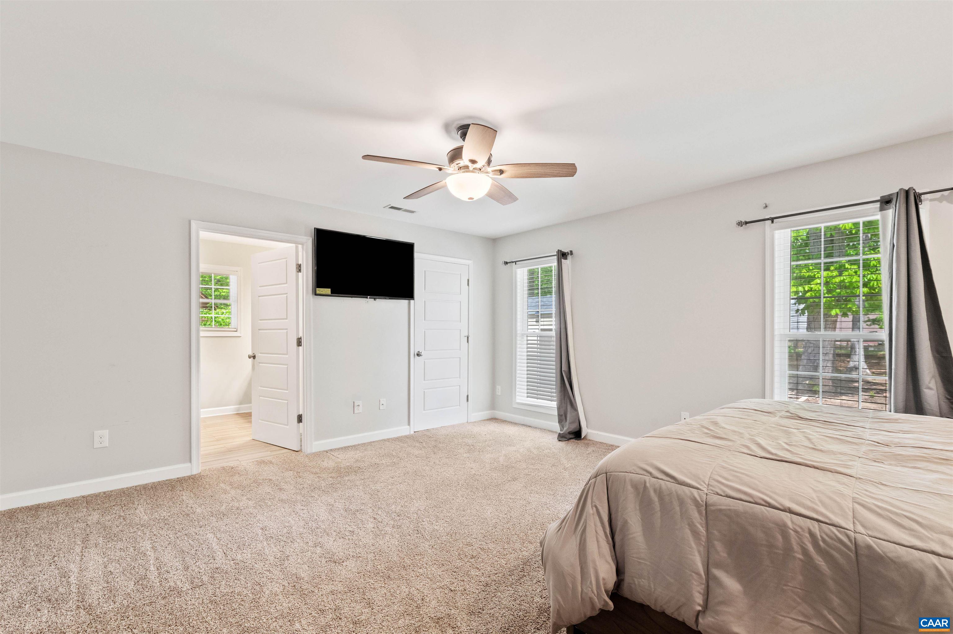 31 Oak Grove Road Palmyra, VA 22963 - Photo 13 of 28 a bedroom with a bed and a flat screen tv